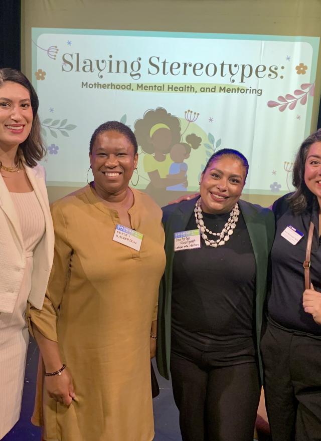 Leticia Garay standing with Alex Svensson and two guests from her panel