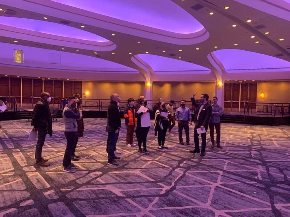 2022 ROMBA conference team examines a conference room in Washington D.C.