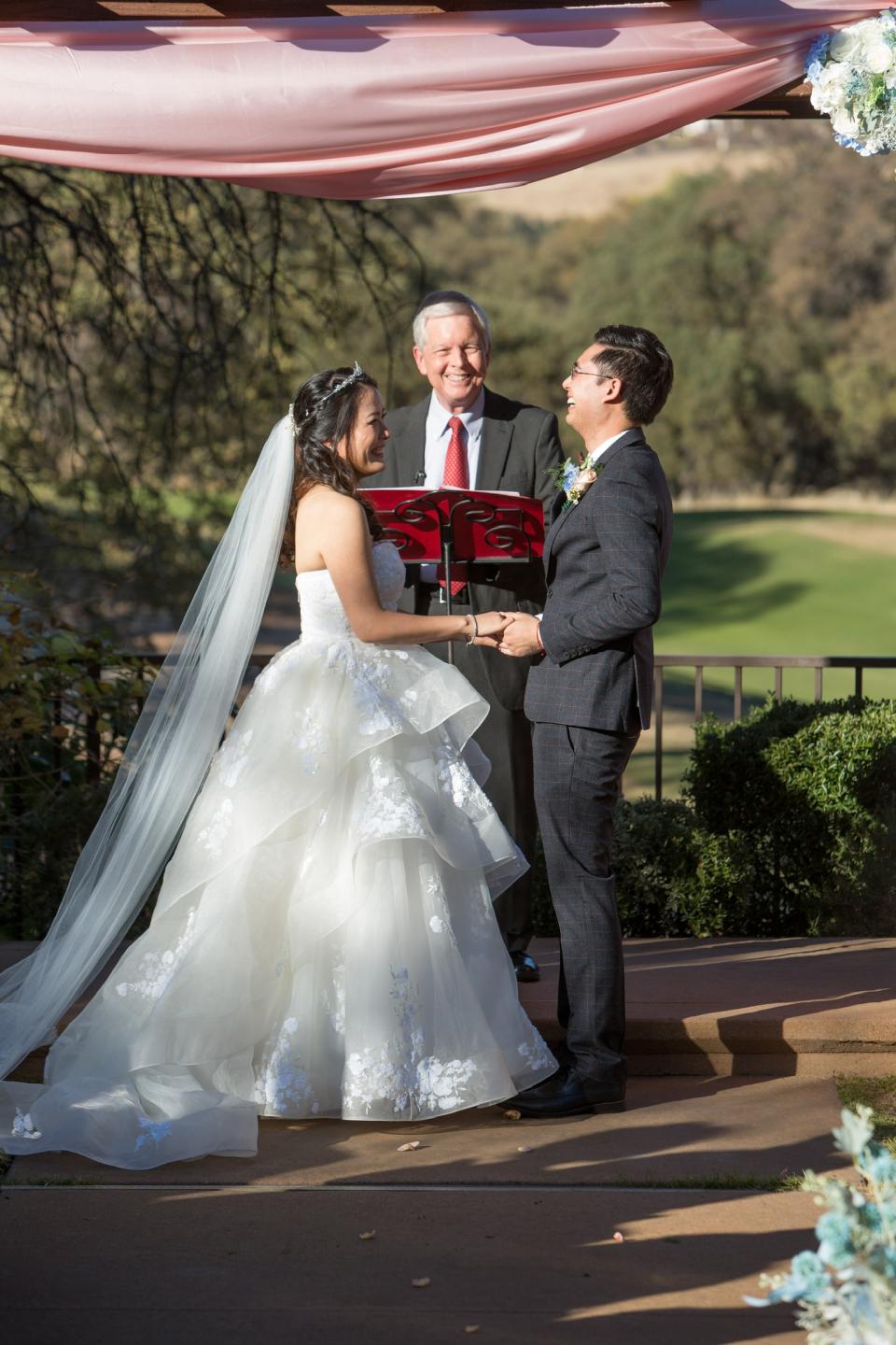 Jialei Emily Sun getting married at the alter with her husband and Professor Will as their officiant