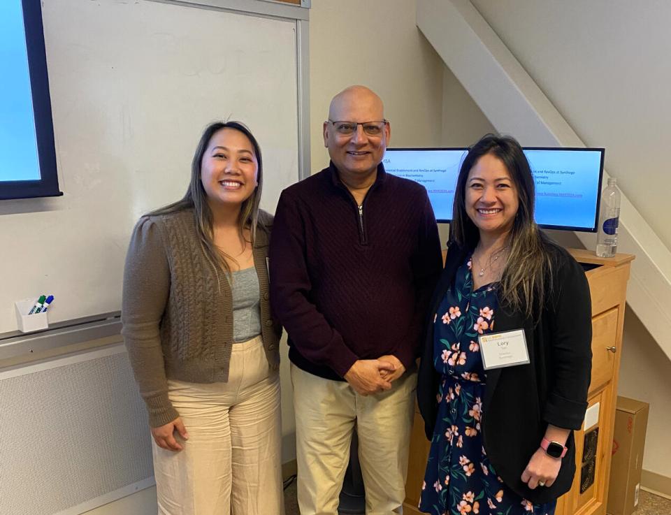 Kathy Truong, Hemant Vaidya, and Lory Tan in a classroom