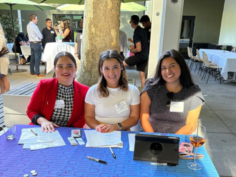 Marisol Ibarra sitting at an event table