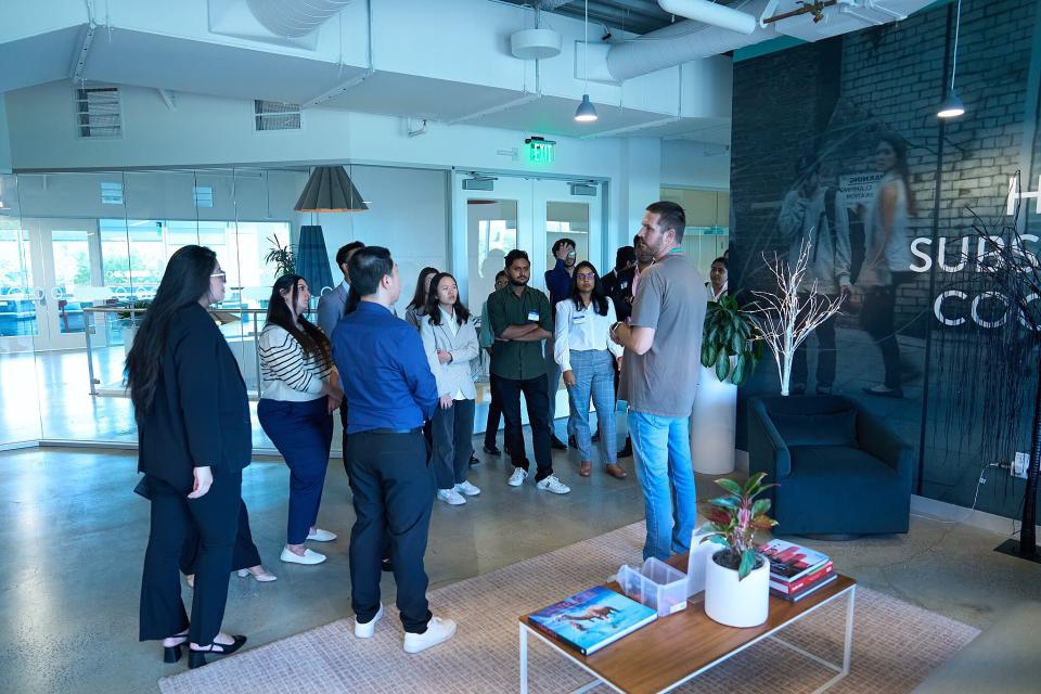 UC Davis students talking to an employee in the Zuora offices