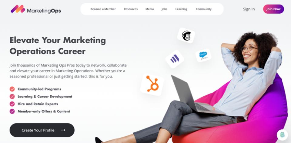 screenshot of MarketingOp.com website with a woman sitting on a beanbag