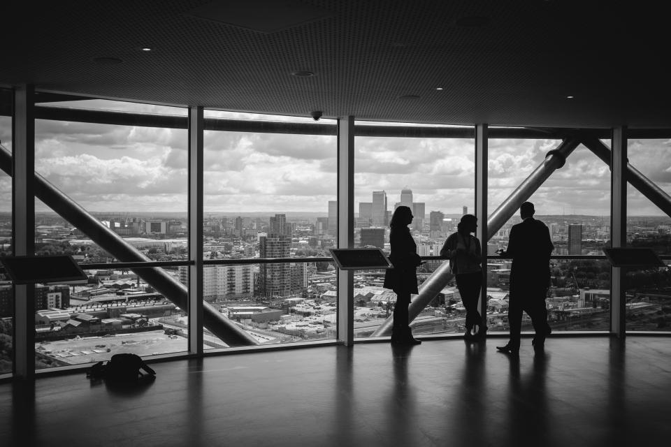 group of individuals overlooking city