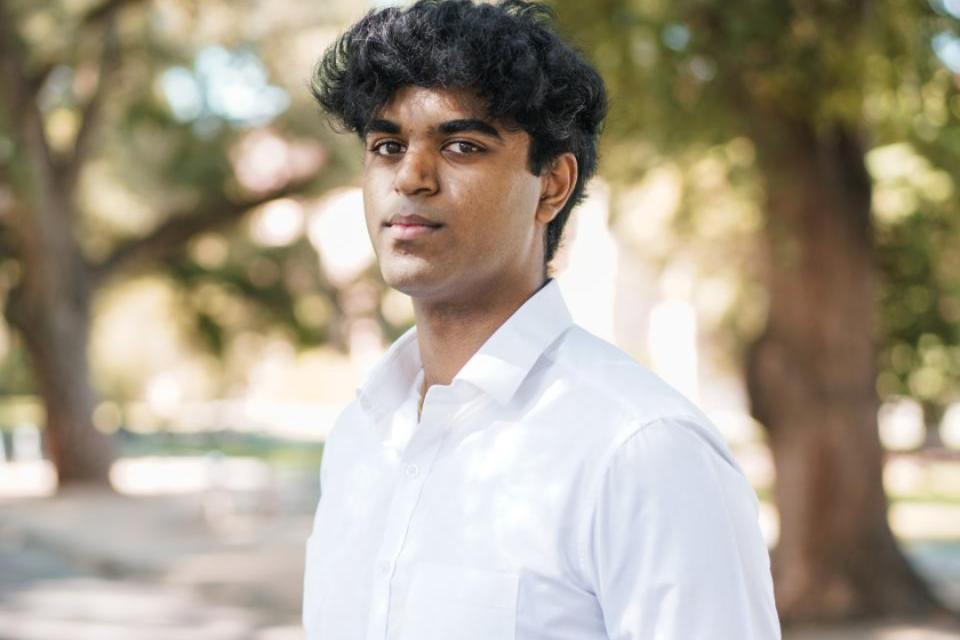 Anirudh Murugesan standing outside